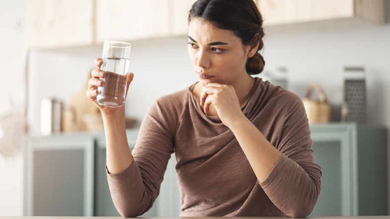 Looking at a glass of water with suspicion